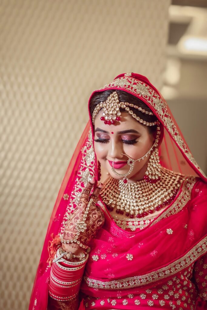 Bride in a red and gold lehenga