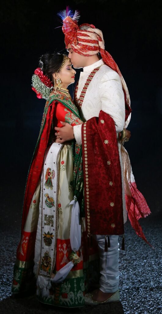 Groom kissing the bride's forehead
