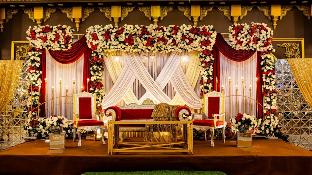 Reception stage dressed in red and white roses